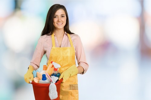 Technician cleaning fabric furniture with care